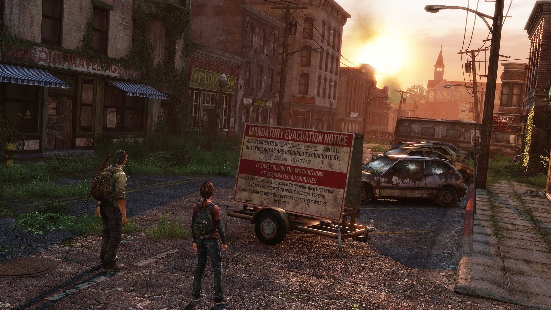 Joel i Ellie na screenie z gry The Last of Us w scenerii zniszczonego miasteczka