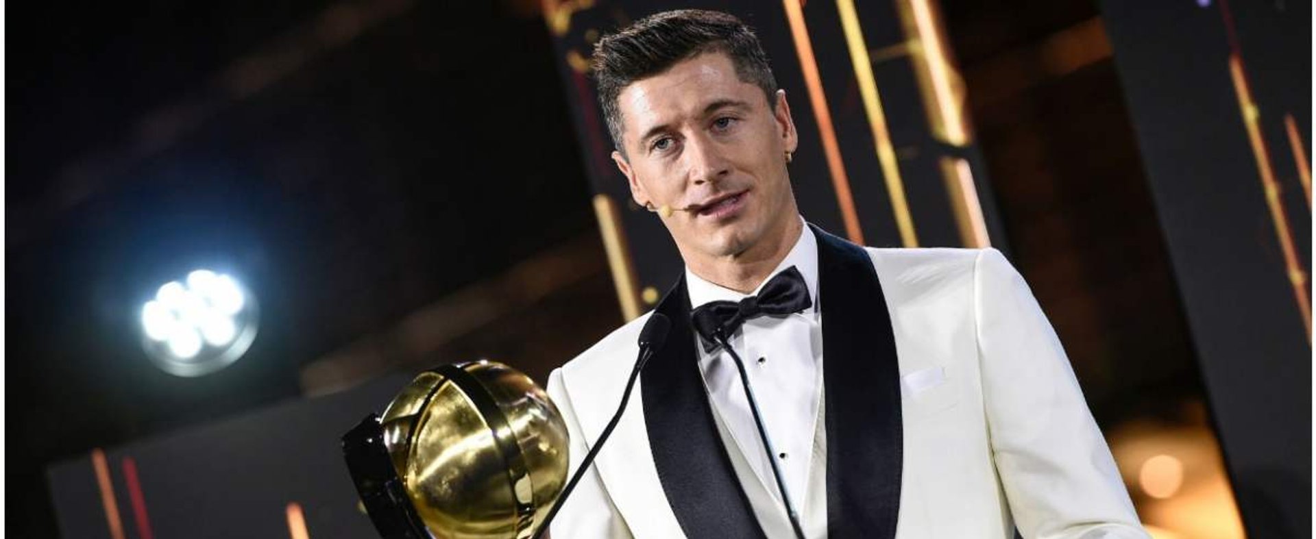 This handout picture made available on December 27, 2020 shows Polish footballer Robert Lewandowski accepting the "Player of the Year 2020" award during the 12th Dubai Globe Soccer Awards ceremony in Dubai. (Photo by Fabio FERRARI / La Presse / AFP) / ===