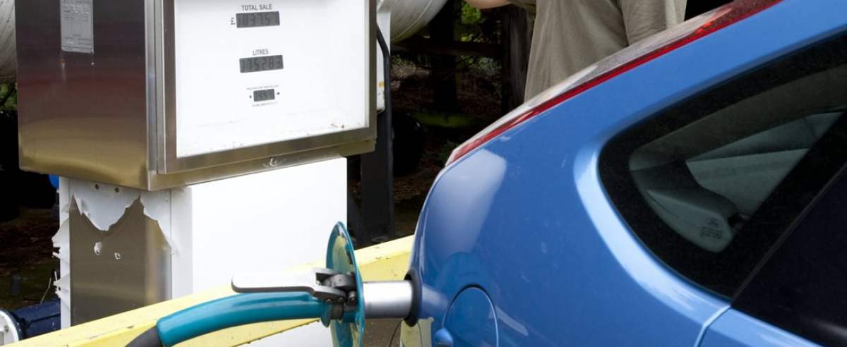 Refuelling liquefied petroleum gas car. Pump being used to refuel a car with a liquefied petroleum gas (LPG, in this case propane). Car engines that run on LPG produce less carbon dioxide and pollutant emissions than cars running on diesel or petrol. This