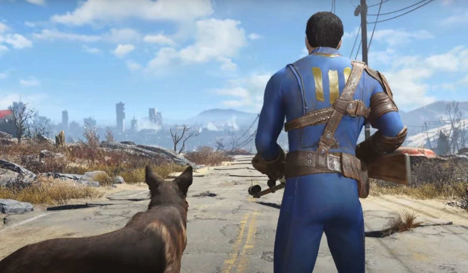 Bohater gry Fallout 4 z psem u boku na opustoszałej, spękanej drodze