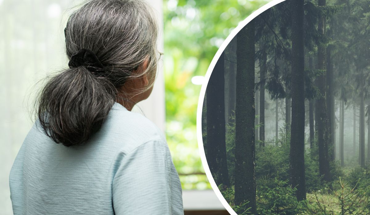 Starsza kobieta patrzy w stronę lasu