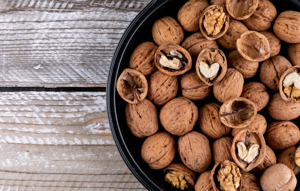 top-view-walnuts-bowl-with-copy-space-wooden-horizontal.jpg