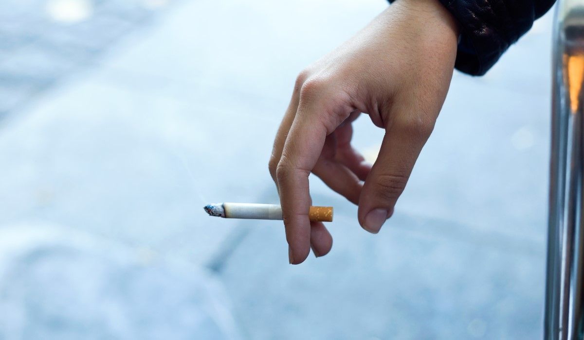womans-hand-with-cigarette-street.jpg